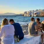 Mykonos-Greece-youth-summer-2021-crowd-island-travel-coronavirus-sea-millenials-beach-party-credit-GR-696×391.jpeg